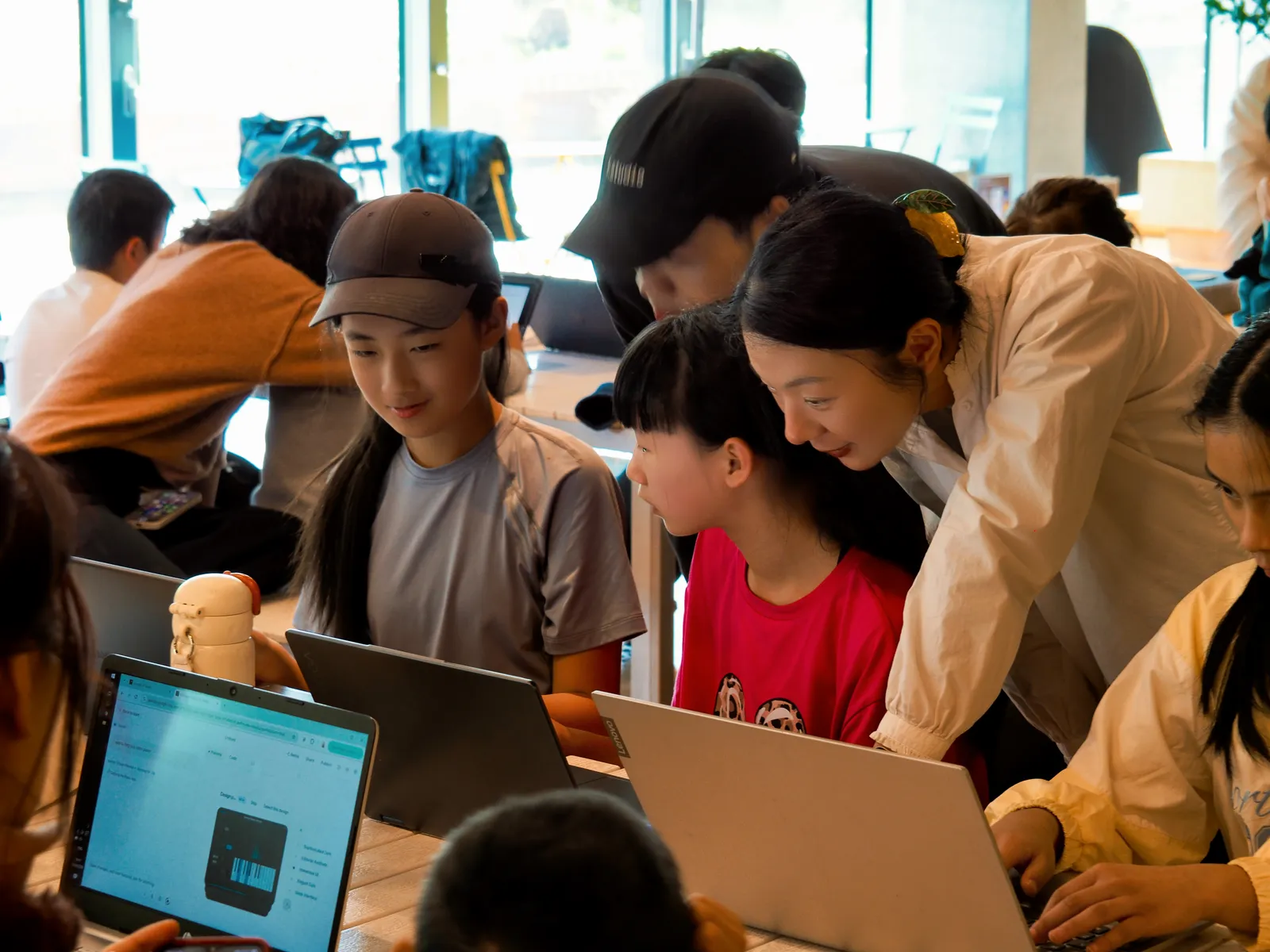 A mentor working one-to-one with a student on their design